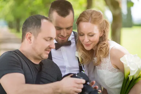 Professional Photographer talking with clients